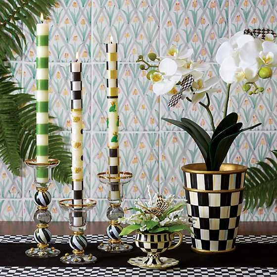 Set of Green Bands dinner candles with hand-painted horizontal stripes on a cylindrical silhouette.