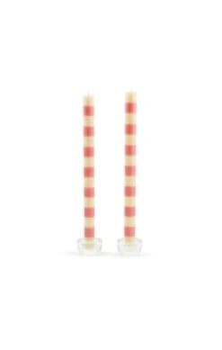 Two pink beeswax dinner candles with a cylindrical shape.