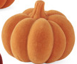 Small orange flocked resin pumpkin with a textured finish and realistic stem.