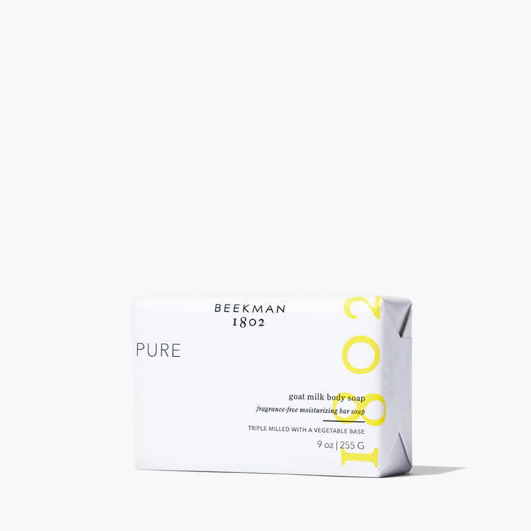 Rectangular bar soap with a creamy off-white color featuring subtle speckles from goat milk and vegetable base ingredients.