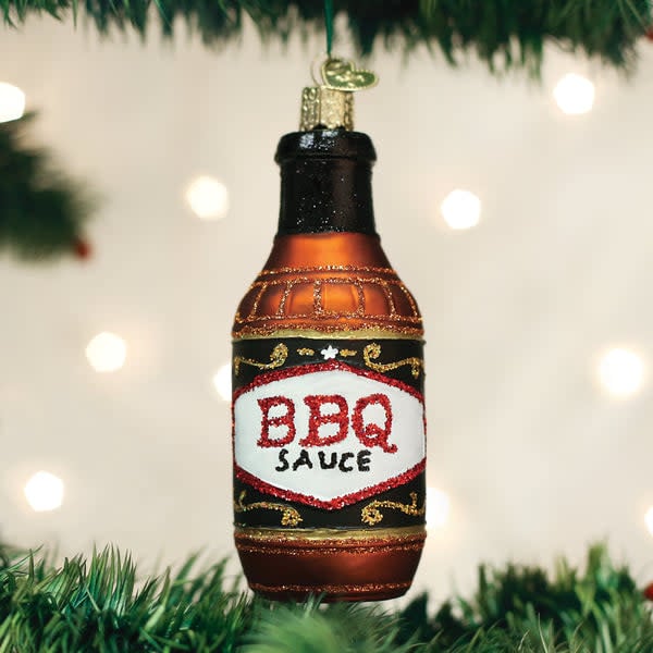 Black barbecue sauce bottle ornament with white label detailing condiment uses.