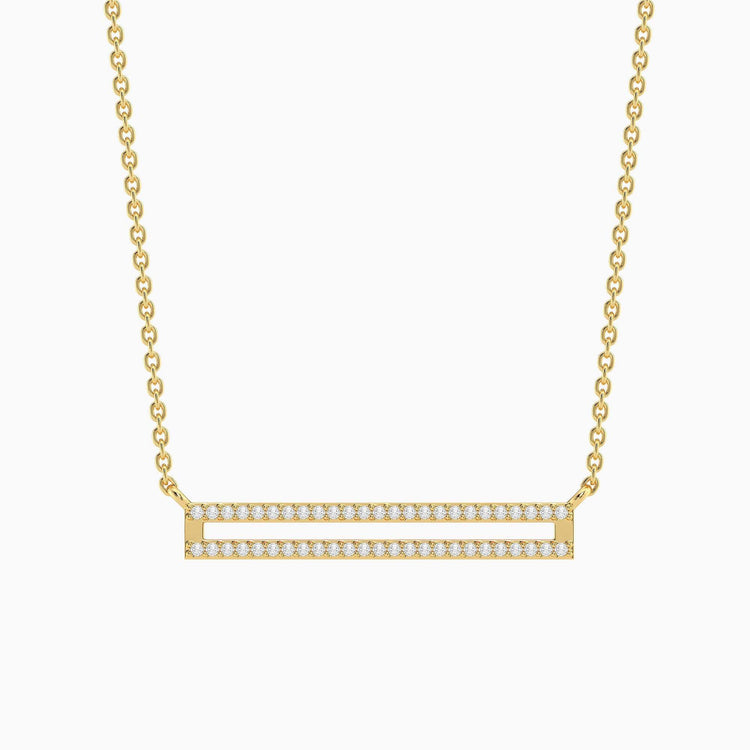 Gold plated stainless steel bar pendant necklace on a silver chain with lobster clasp closure.