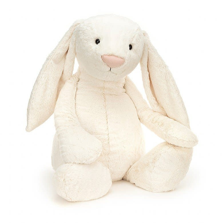 Cream-colored plush bunny toy with long ears resembling clotted cream.