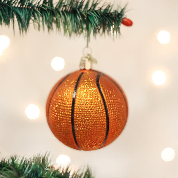 Glass basketball ornament with textured surface in orange and black colors.