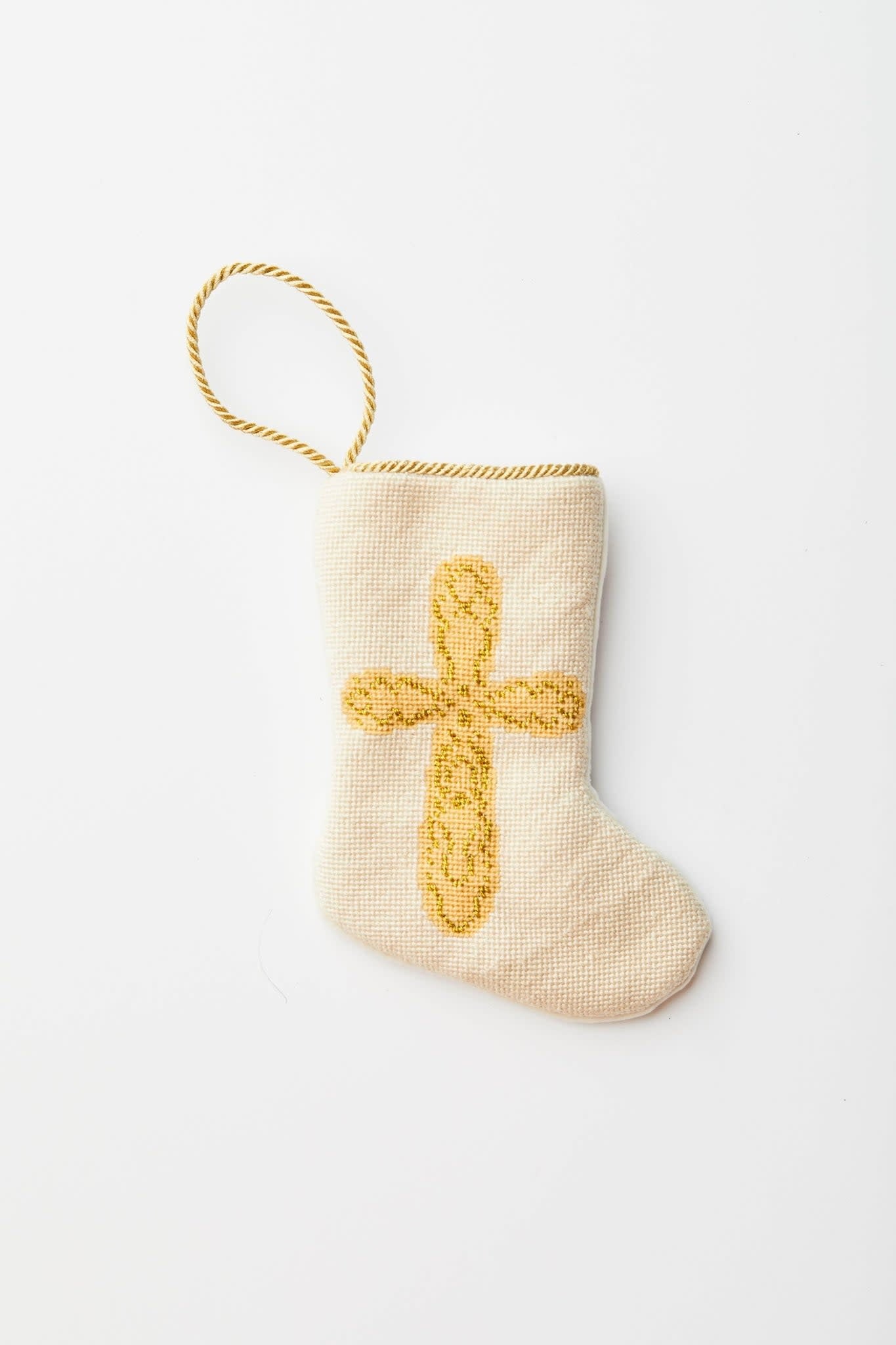 Hand-stitched needlepoint stocking in Prince Of Peace cross design with velvet backing.