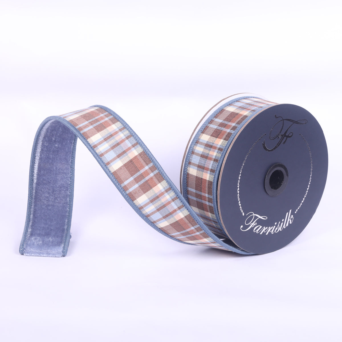 1.5 inch wide plaid plush ribbon in steel blue and chocolate brown on a spool.
