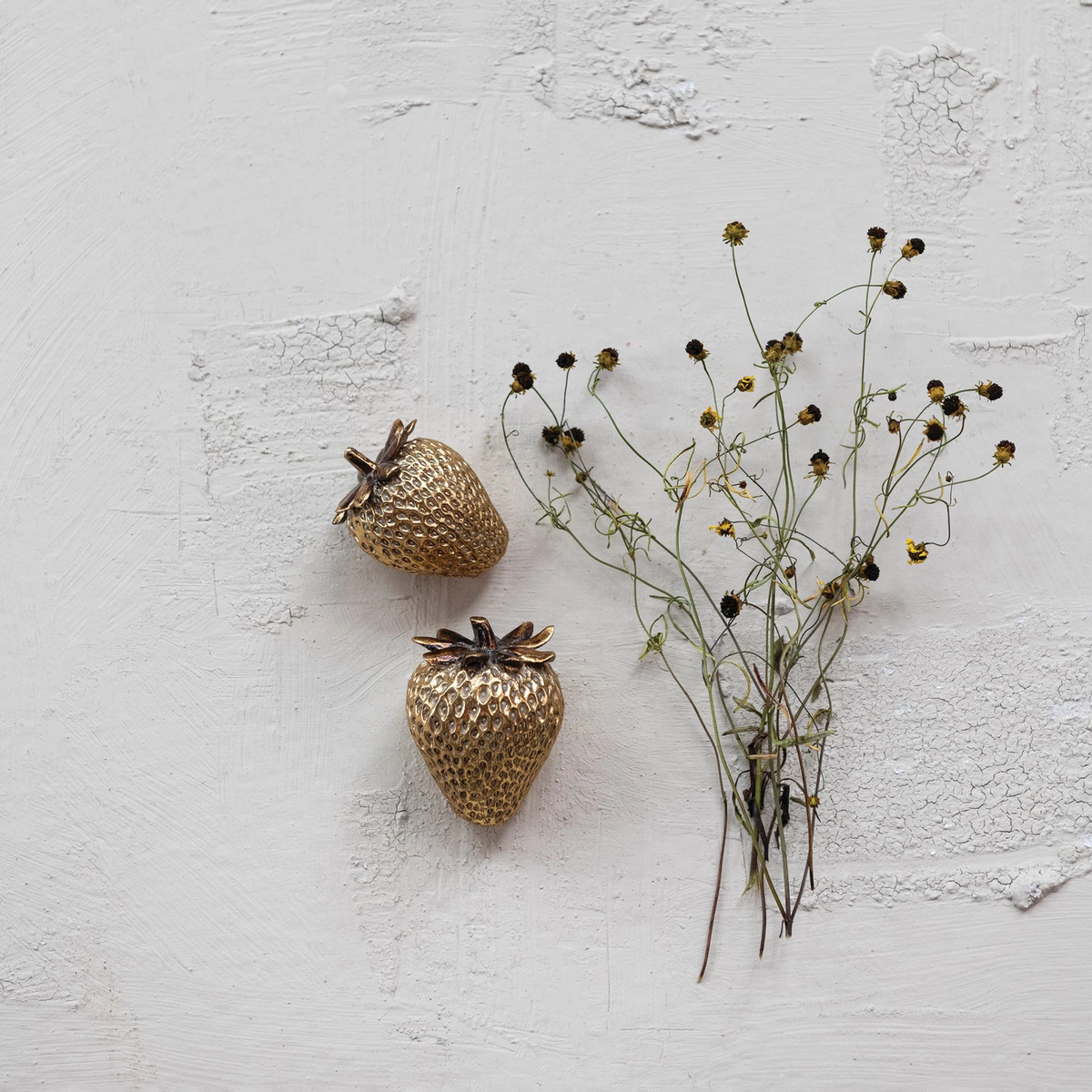 Gold-finish resin strawberry figurine with realistic leaf detail