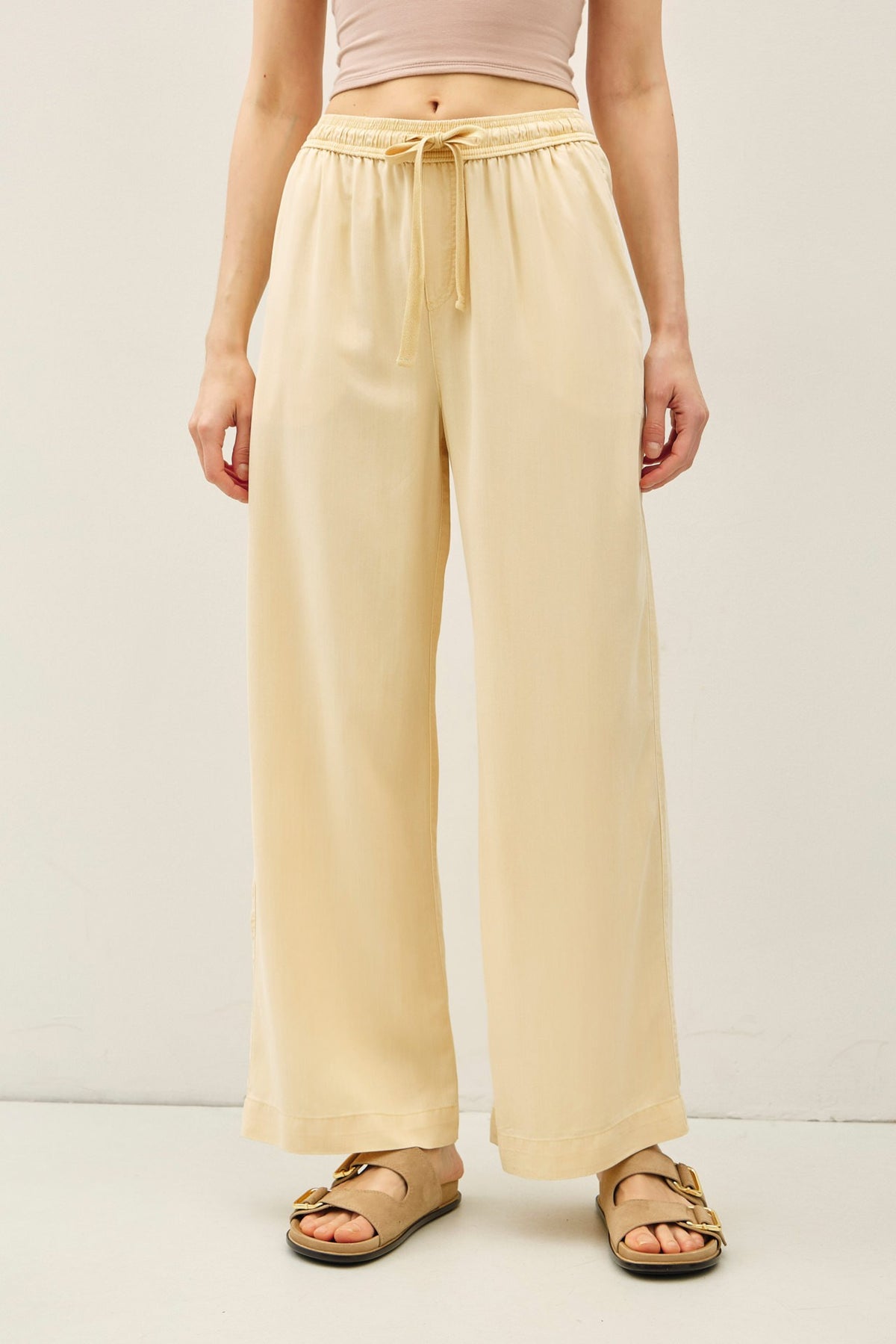 Women's Jane Tencel wide-leg pant in neutral tone with elastic waistband and side pockets.