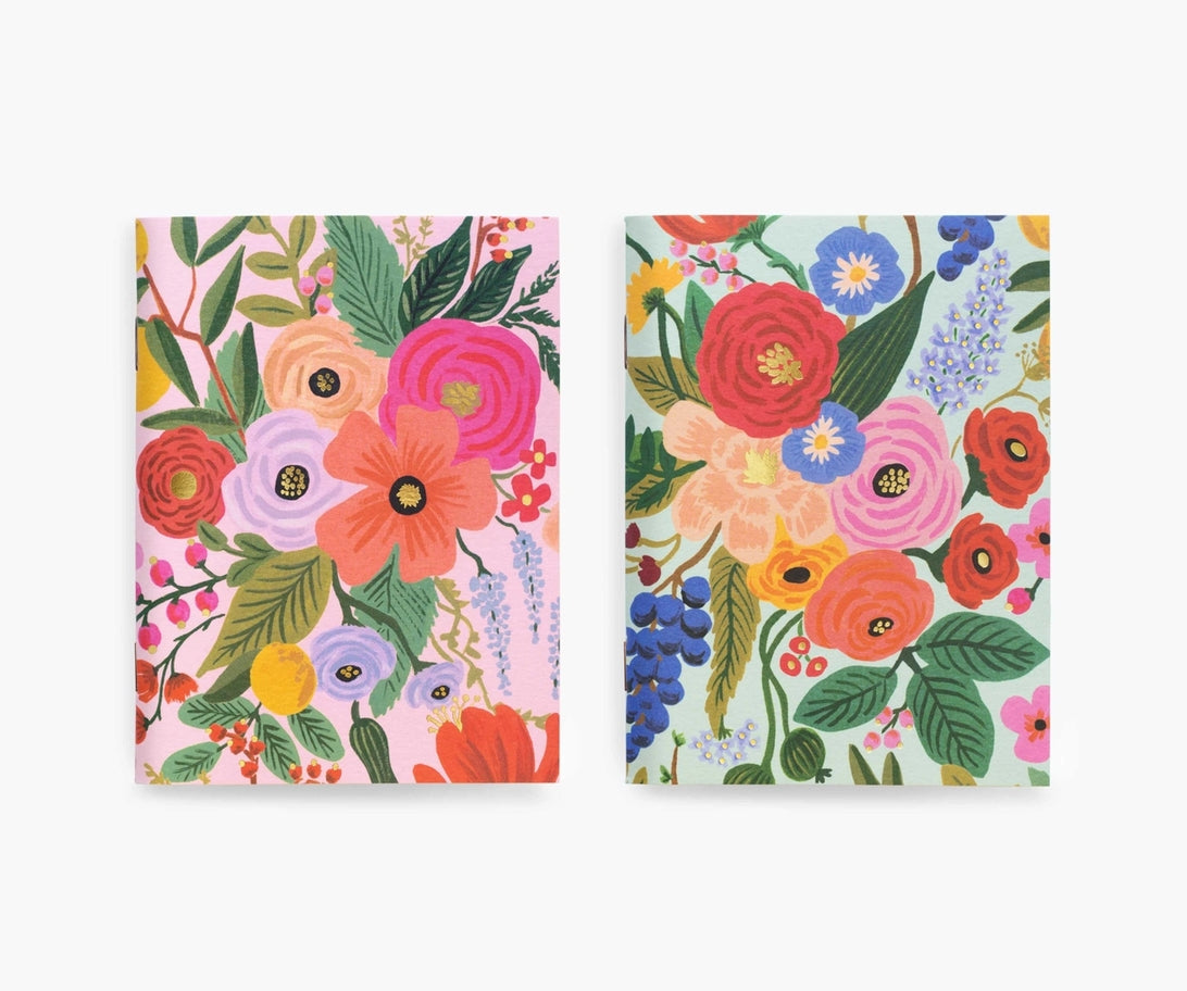 Pair of saddle-stitched pocket notebooks with uncoated natural vellum covers featuring metallic gold foil stamping.