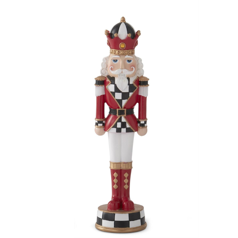 Red and black harlequin check nutcracker figurine with a crown and white pants.