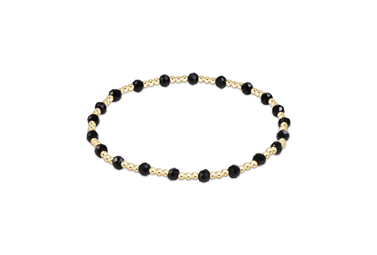 Gameday Flirty Sincerity Bracelet featuring alternating gold beads and faceted black beads.