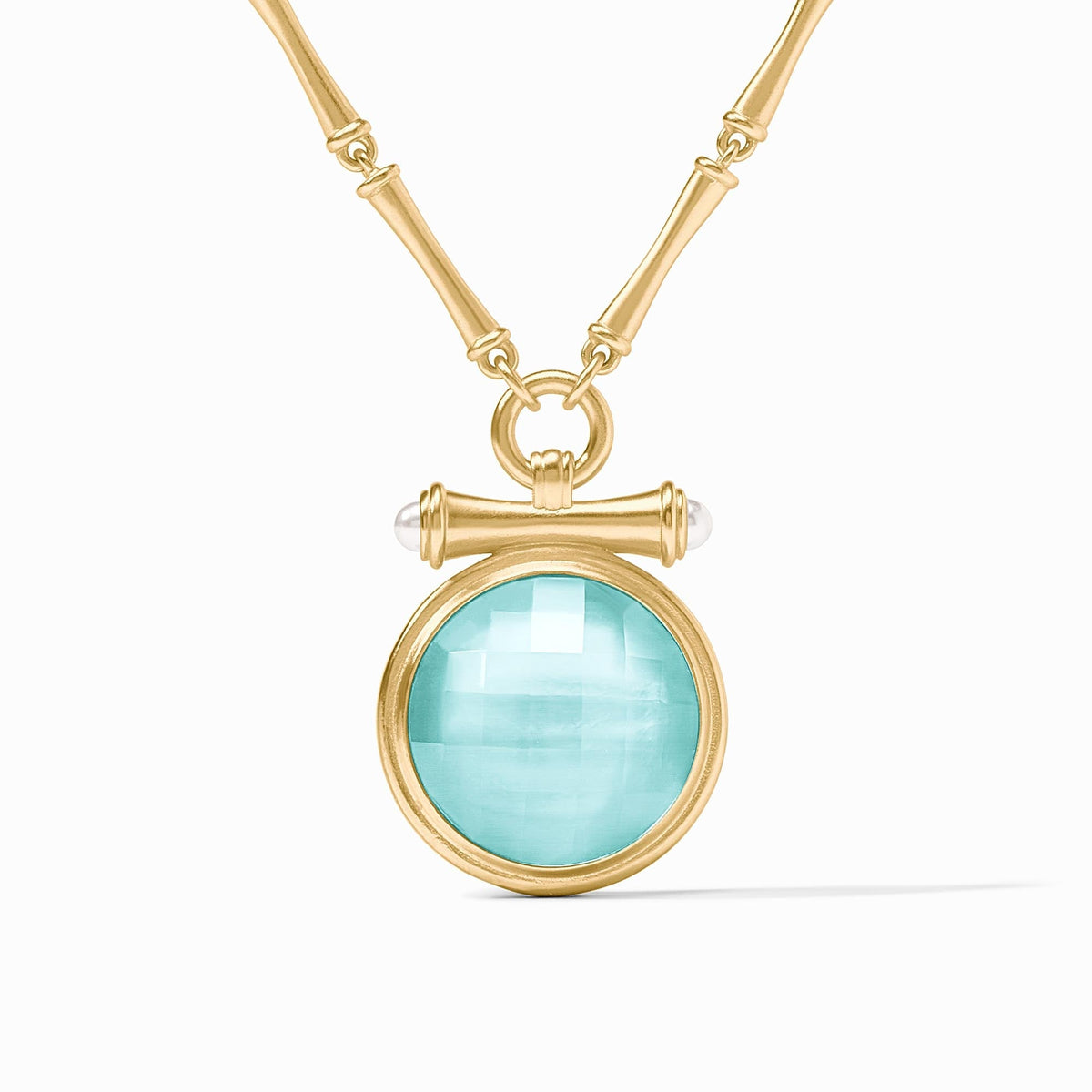 Adjustable bamboo link necklace with golden pendant featuring a pearl cap over a round gemstone.