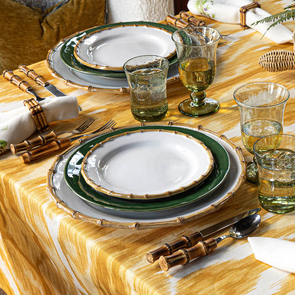 Classic Bamboo white ceramic dessert plate with a natural bamboo-style rim on a set table.