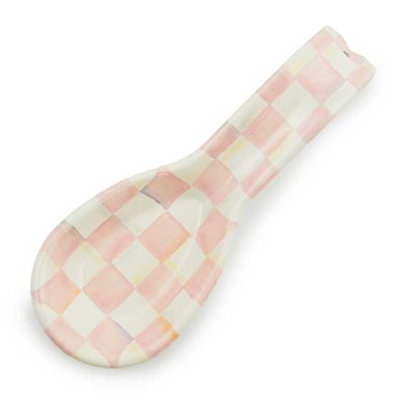 Hand-glazed steel spoon rest with rosy check floral pattern on a dark background.