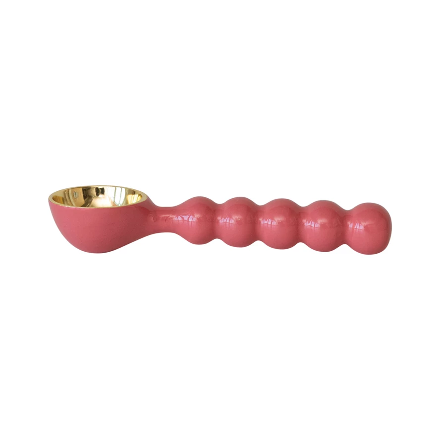 Enameled aluminum ice cream scoop with a smooth handle.