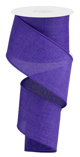 A spool of royal blue burlap-style ribbon made from polyester.