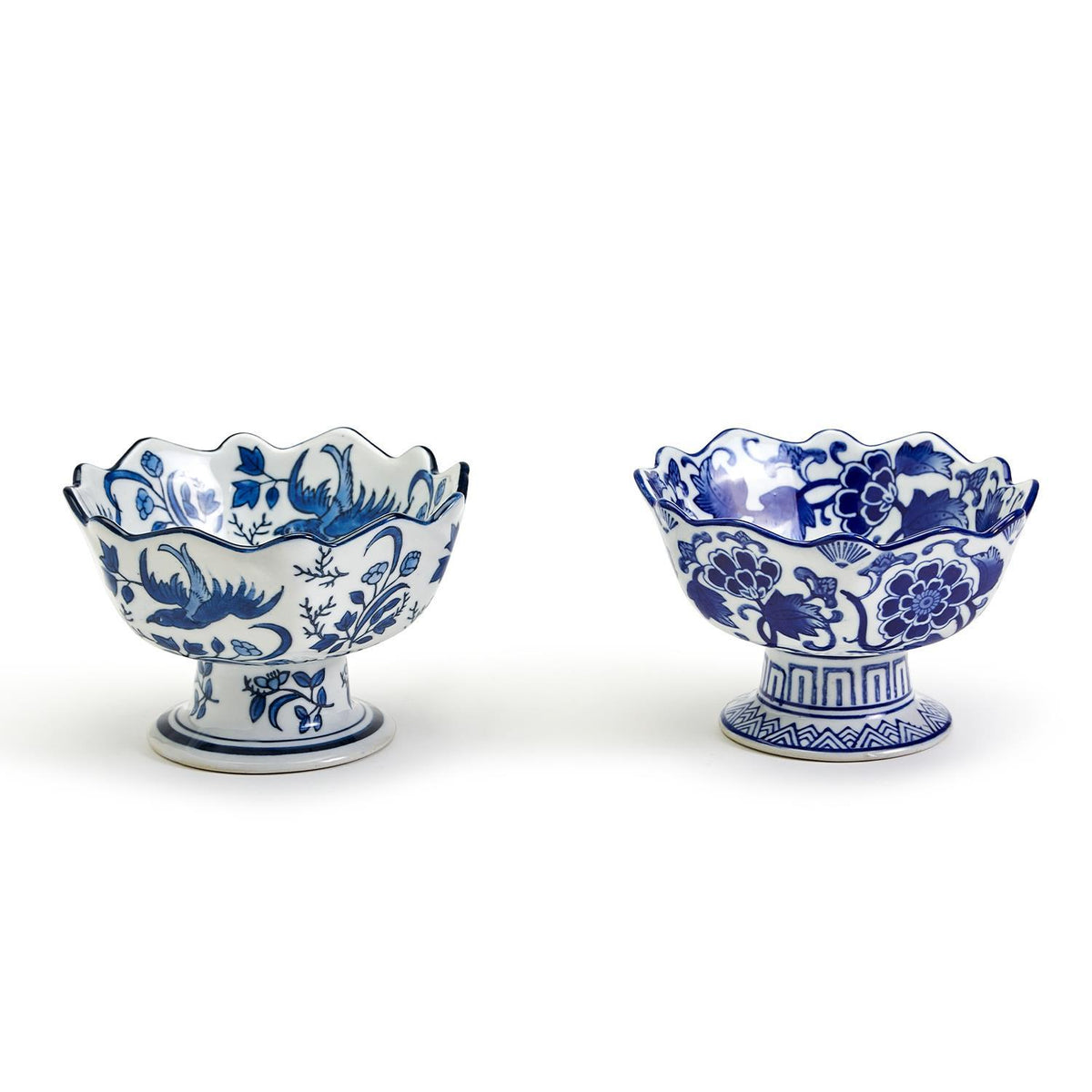 Two hand-painted blue and white porcelain footed bowls with scalloped edges and floral designs.