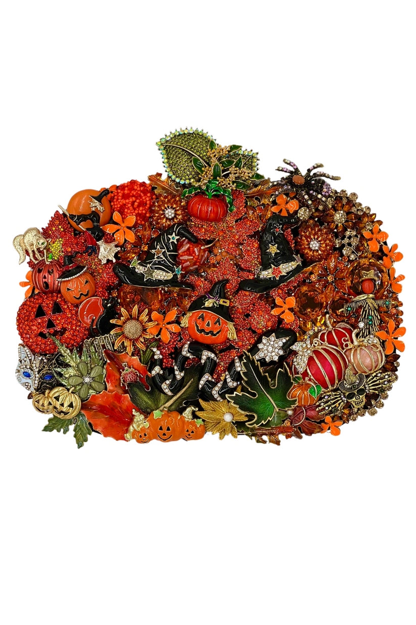 Intricate Halloween-themed pumpkin collage featuring jack-o'-lanterns, witch hats, and fall leaves.
