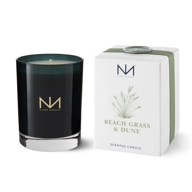 Dark navy glass candle with soy blend wax in Beach Grass & Dune scent.