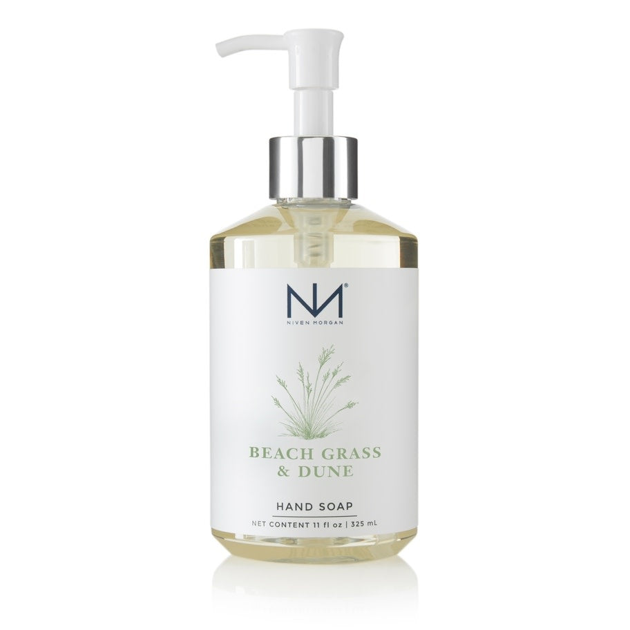 Bottle of Beach Grass & Dune hand soap with a clear liquid inside.