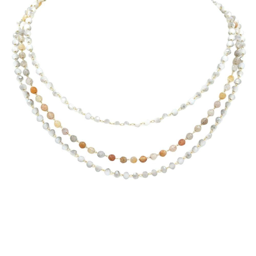 Beaded layered necklace with multiple strands of vibrant beads on a chain.