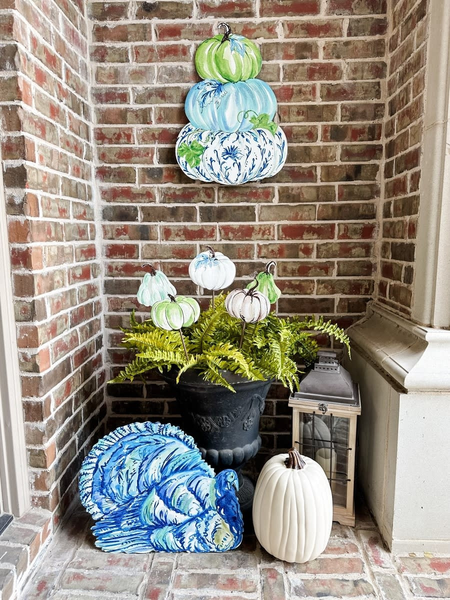 Blue pumpkin stack decor piece with a festive fall silhouette.