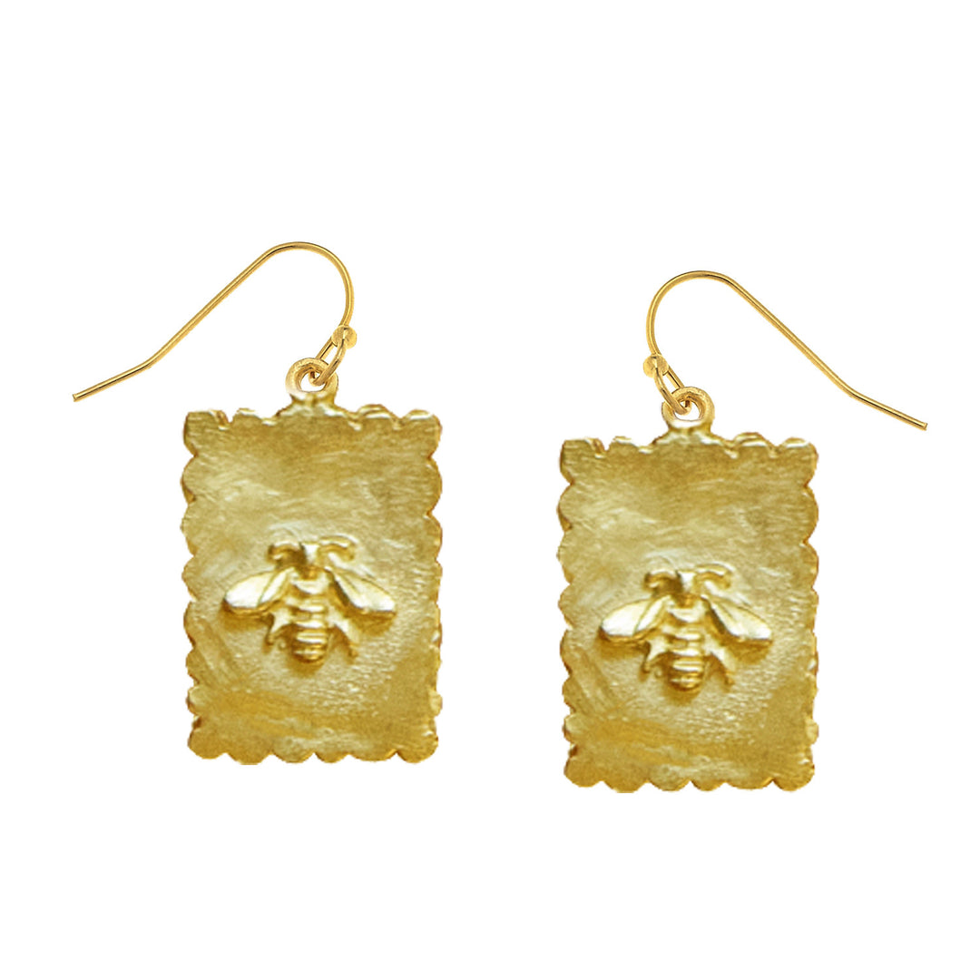 Triple-plated gold bee stamp earrings with intricate insect designs on a post silhouette.