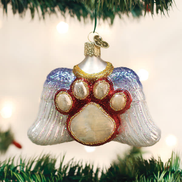 Beloved Pet ornament featuring a white paw print with gold angel wings on a glossy finish.