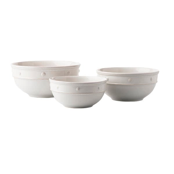 Whitewash ceramic nesting serving bowl with a natural wood grain pattern.