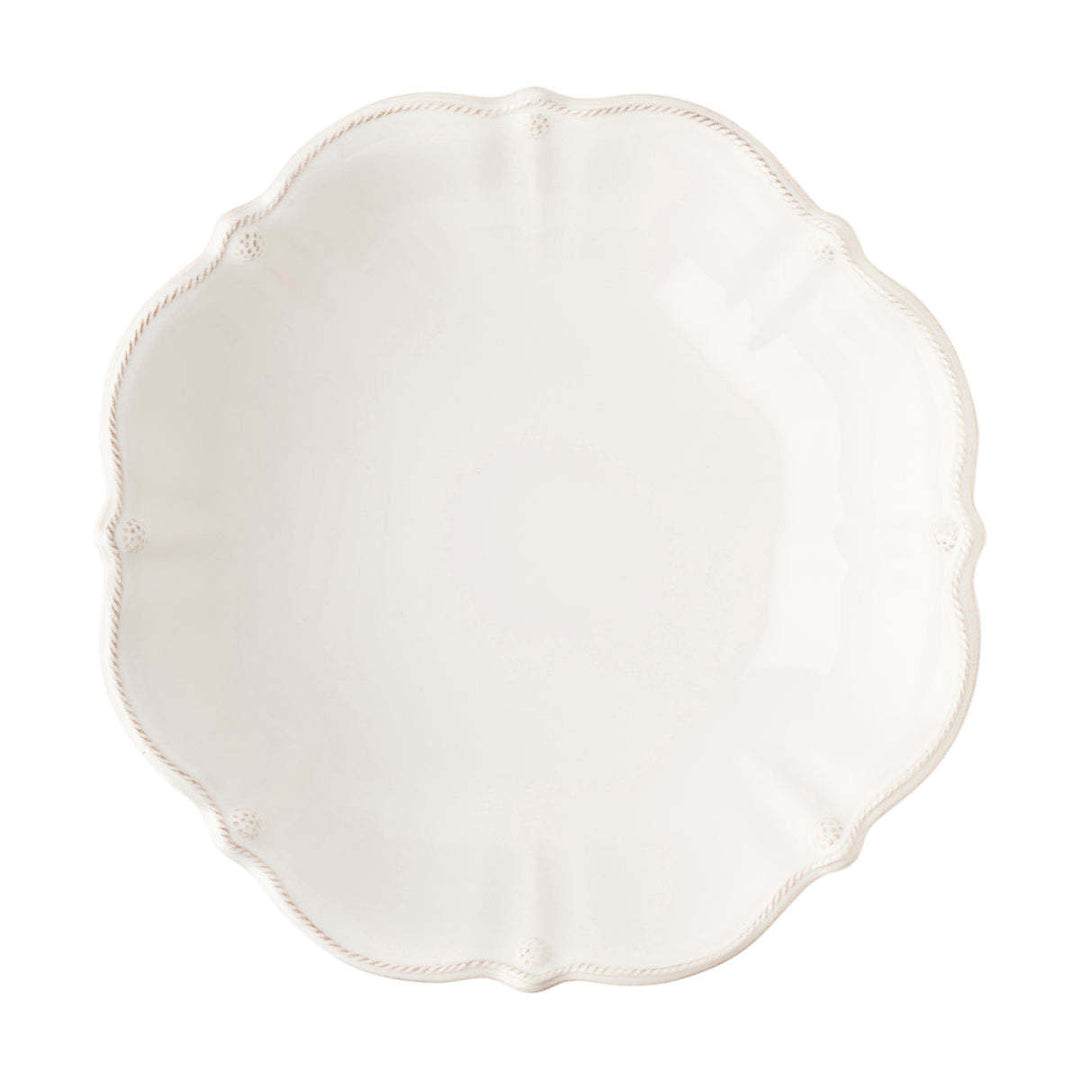 Large whitewash ceramic serving bowl with subtle ruffled rim edges