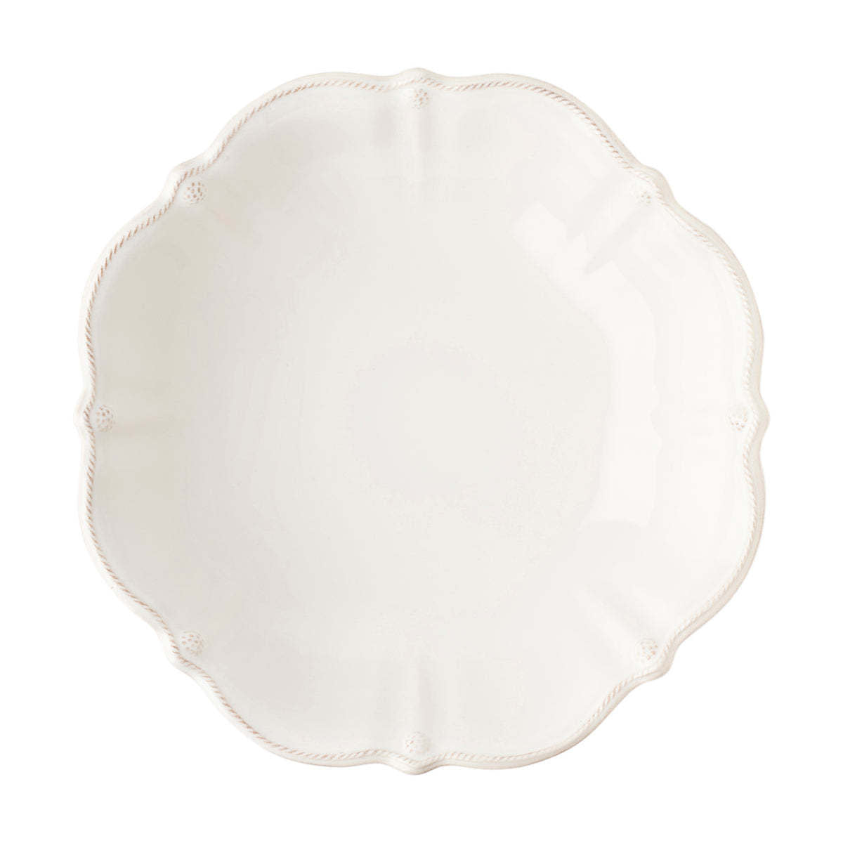 Large whitewash ceramic serving bowl with subtle ruffled rim edges