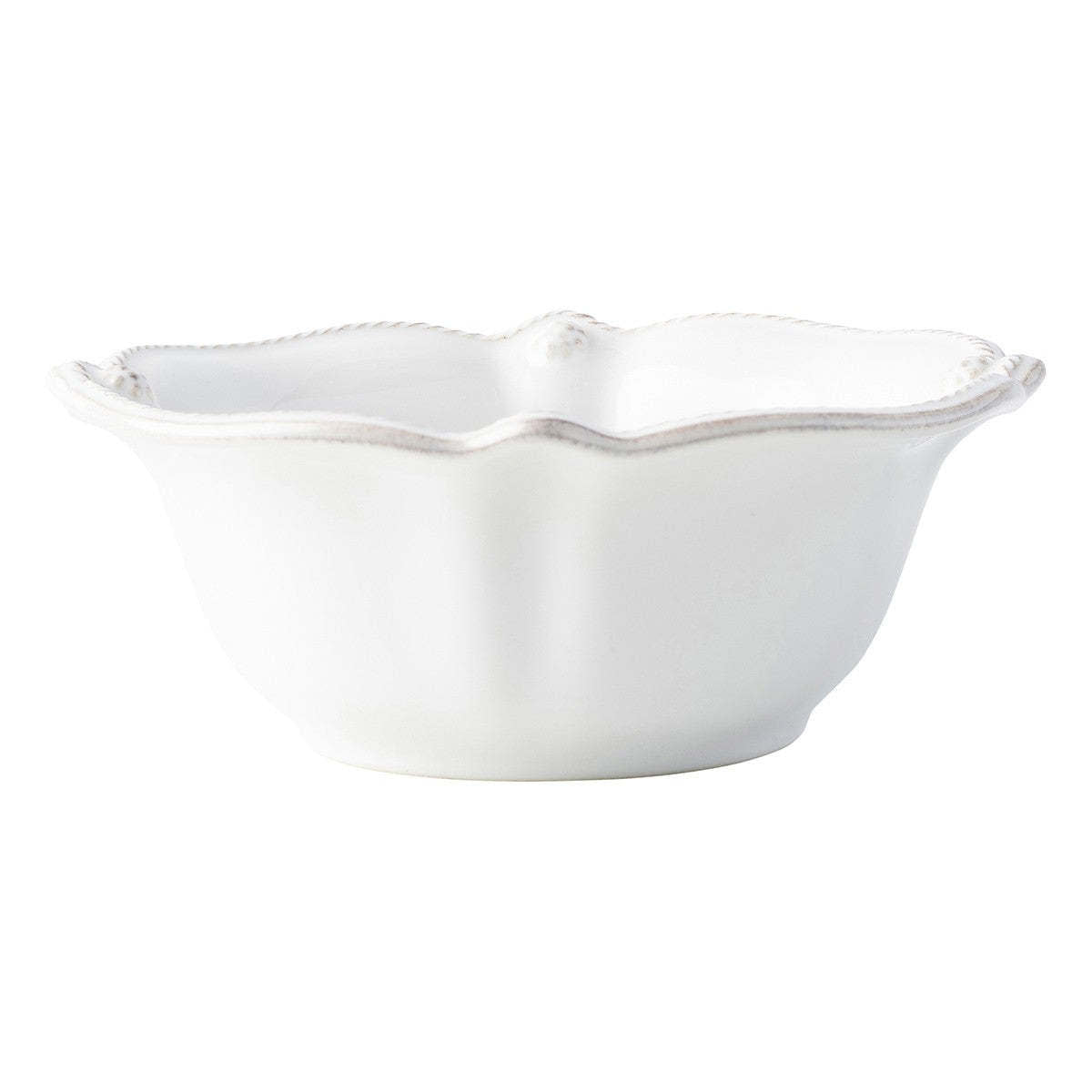 Whitewash ceramic cereal bowl with a subtle scalloped wave rim edge.