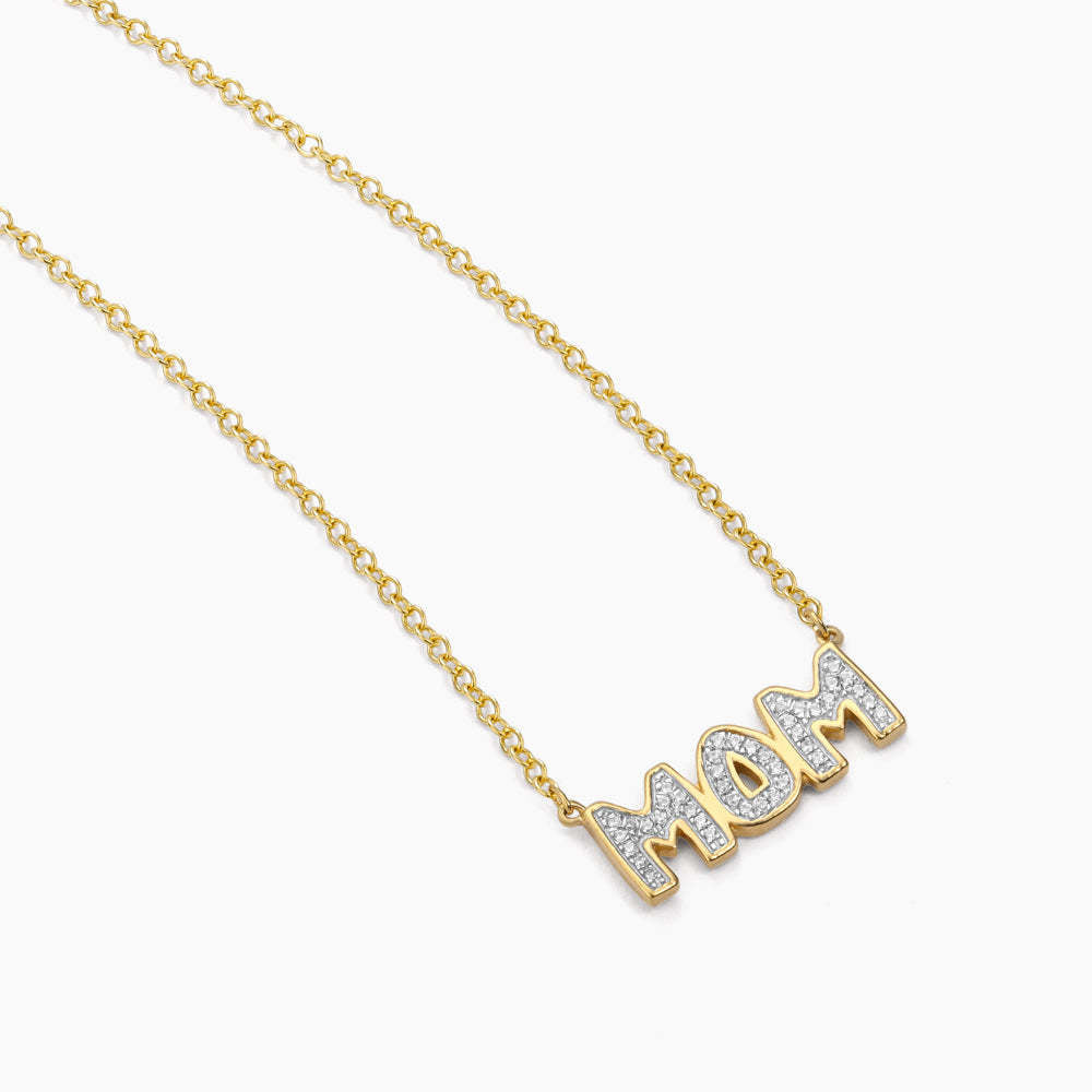 Silver pendant necklace featuring a heart-shaped charm engraved with 'Best Mom In The World' on an 18-inch chain.