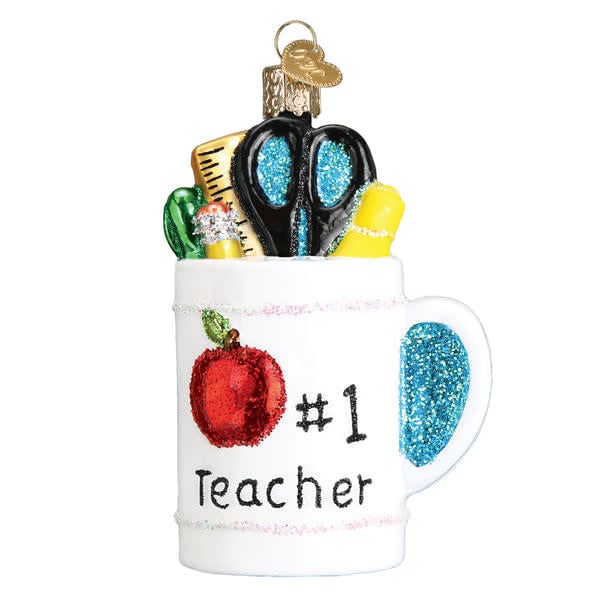 Ceramic mug ornament with 'Best Teacher' text in gold script on a white background.