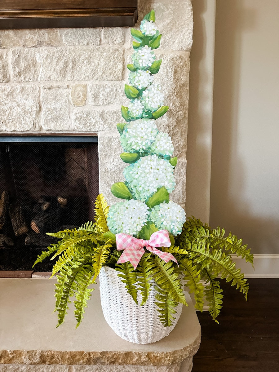 Hydrangea topiary stake with green foliage in a natural silhouette