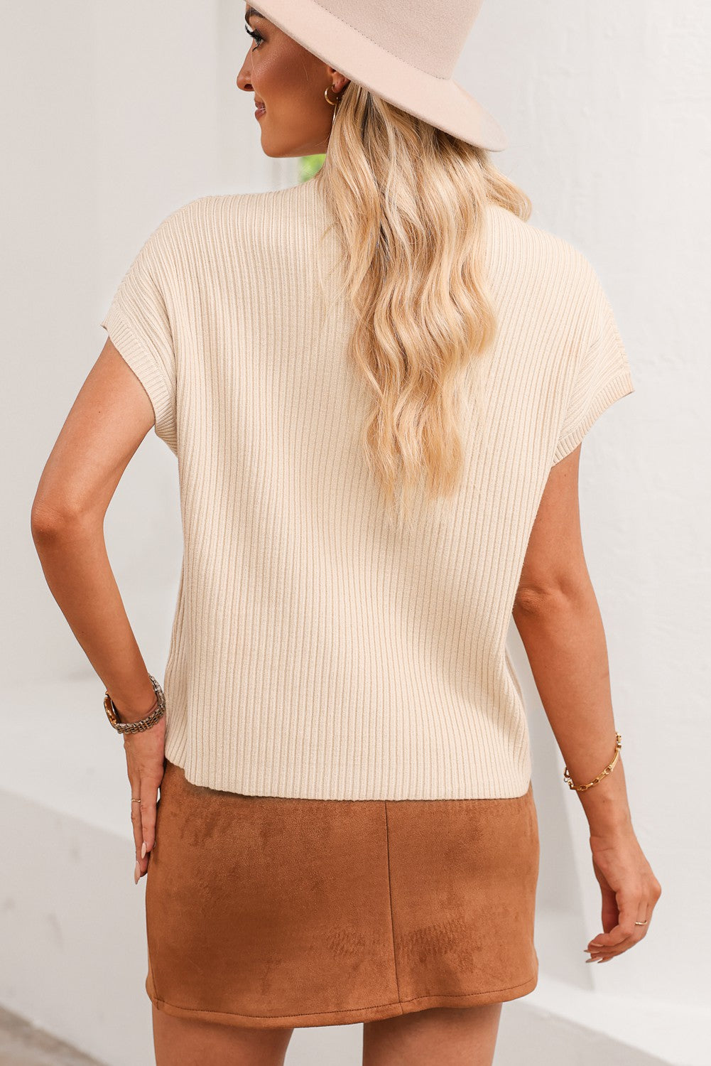 Melissa ribbed knit short sleeve sweater in beige with a patch pocket detail.