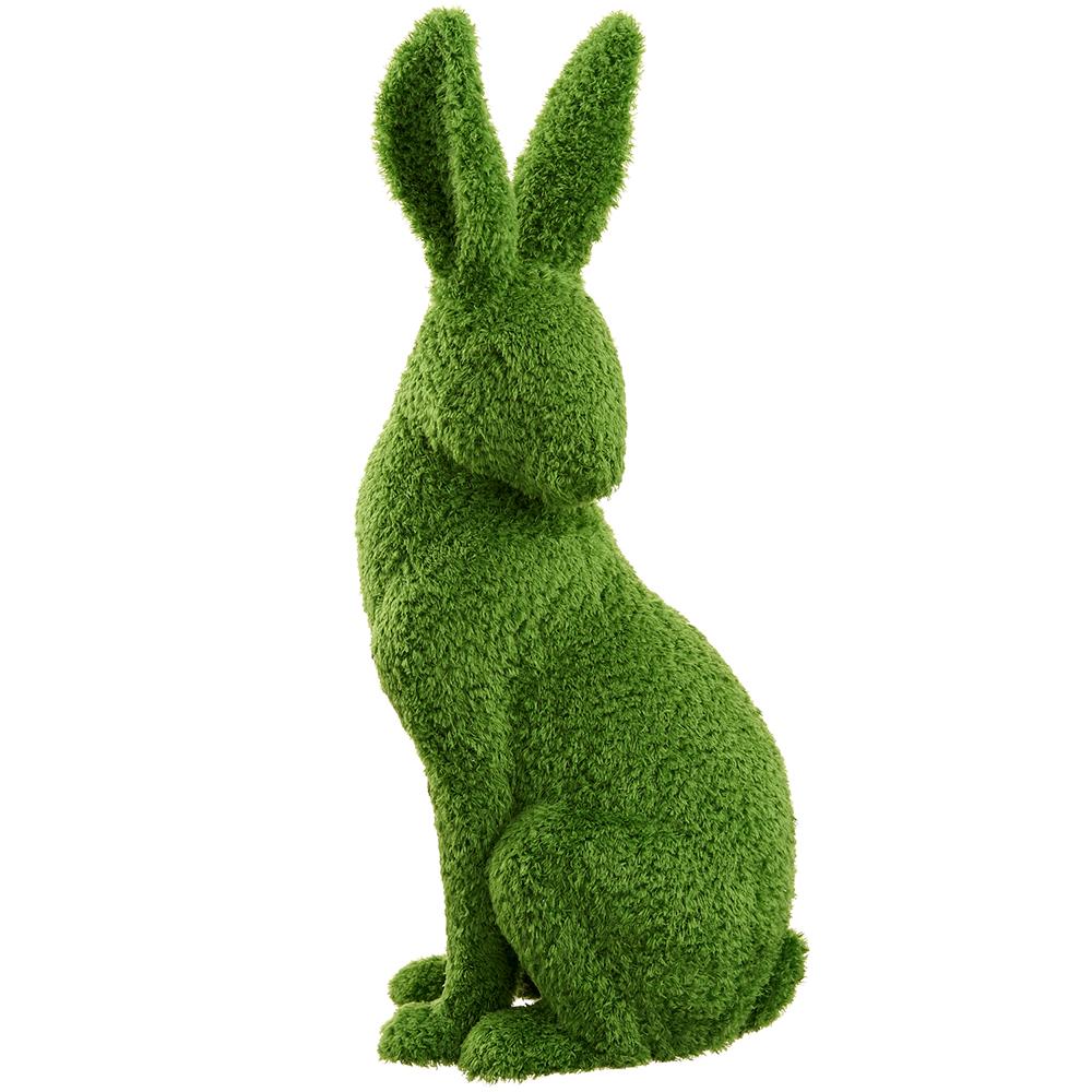 Green furry bunny with moss-covered texture on a white background