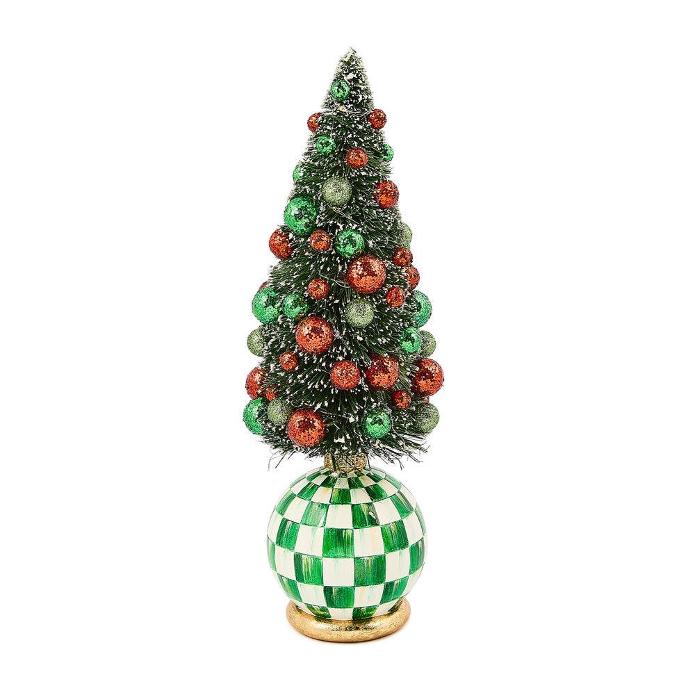 Illuminated resin bottle brush tree with red and green baubles on frost-covered branches.