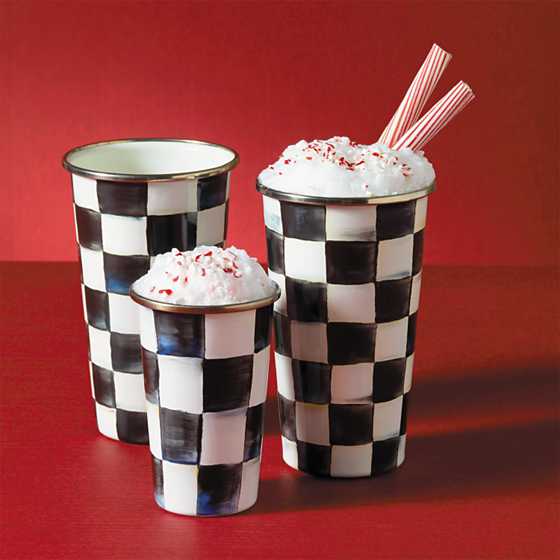 Three Courtly Check enamel tumblers in varying sizes on a red background, filled with frozen treats.
