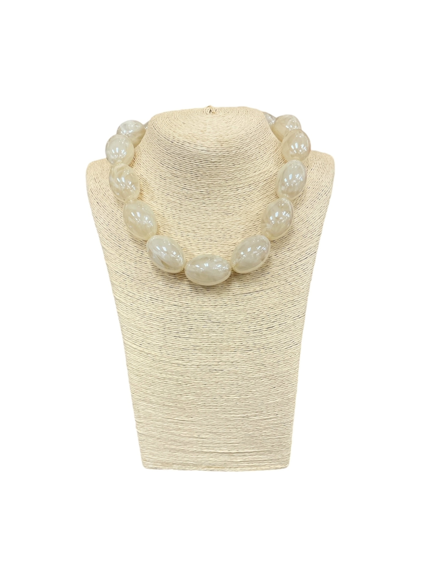 Short necklace featuring large, translucent cream-colored oval glass beads on a jewelry bust.