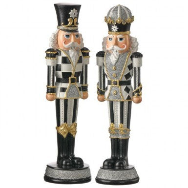 Two 13-inch resin royal nutcrackers in black, white, and gold with glitter accents.