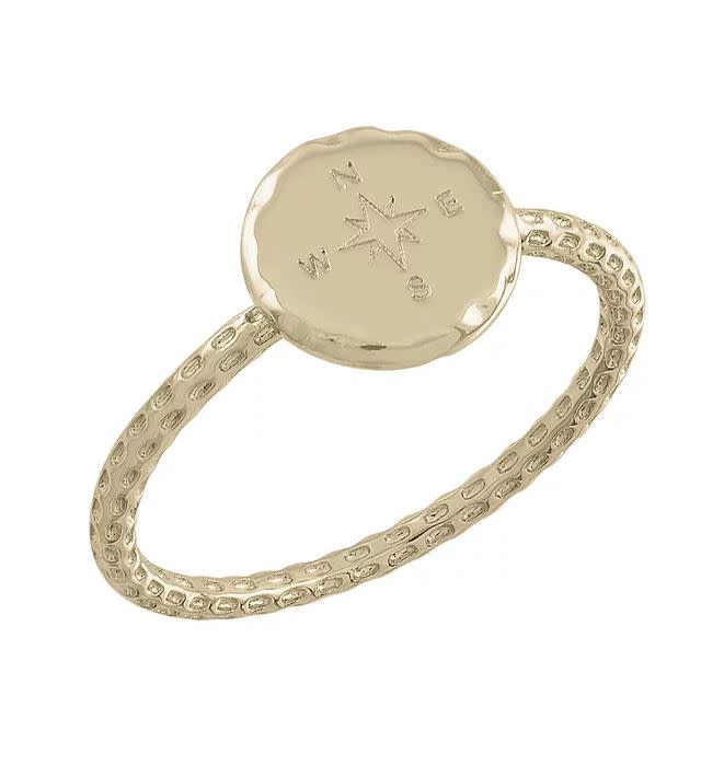 Compass Gold Layers Ring featuring a textured band and a round disc with a compass star engraving.