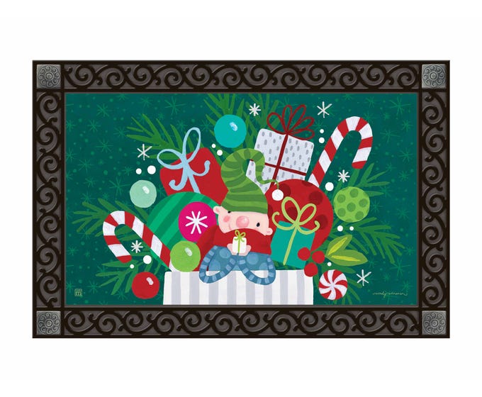 Red Christmas stocking with white trim hanging on a gold hook.