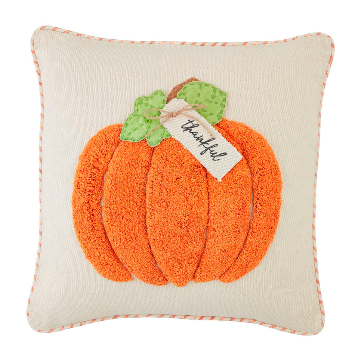 Orange tufted pumpkin-shaped pillow with a textured surface.