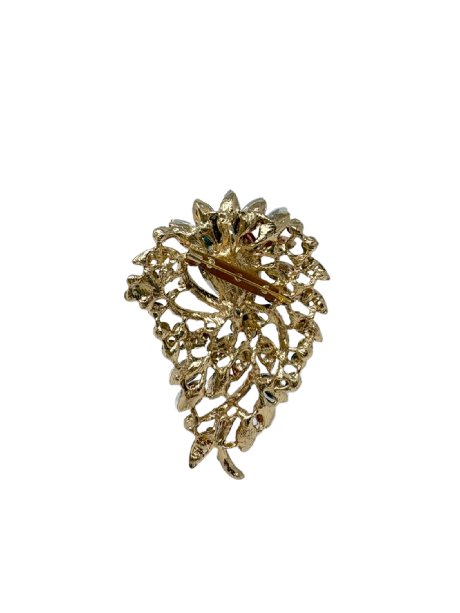 Back view of a gold-tone multi-gemstone statement brooch with a pin fastening.