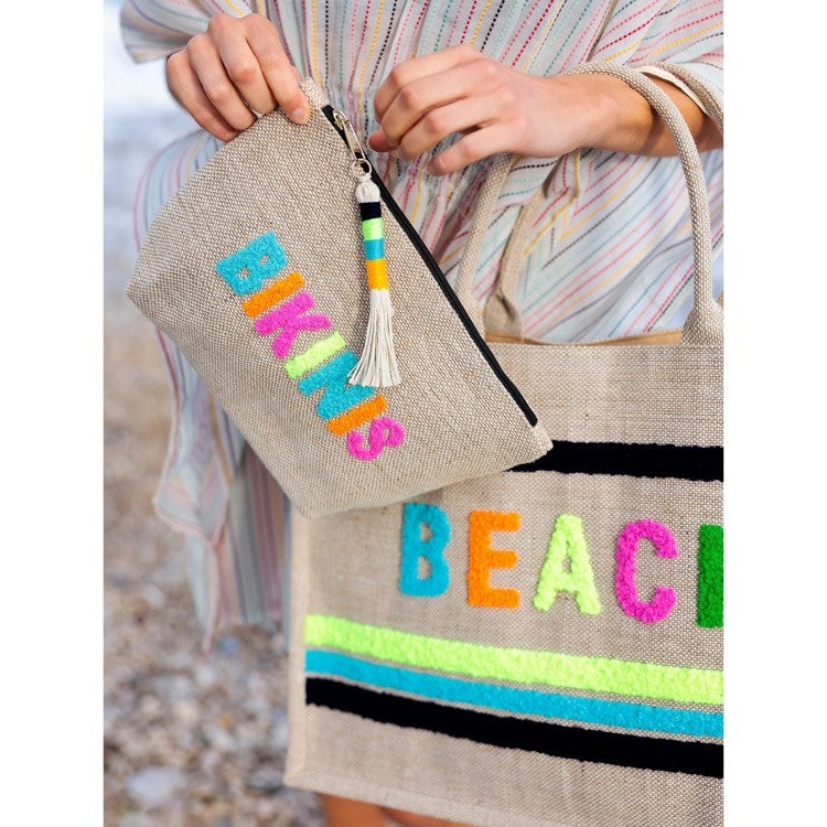 Natural fabric zip pouch measuring 8 inches long by 7 inches tall with a secure closure.