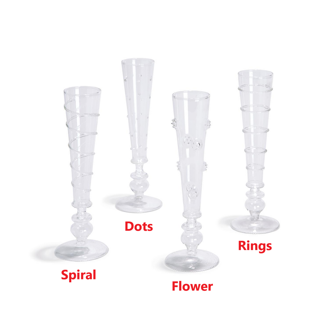 Four hand-blown glass champagne flutes with spiral, dots, flower, and ring patterns.