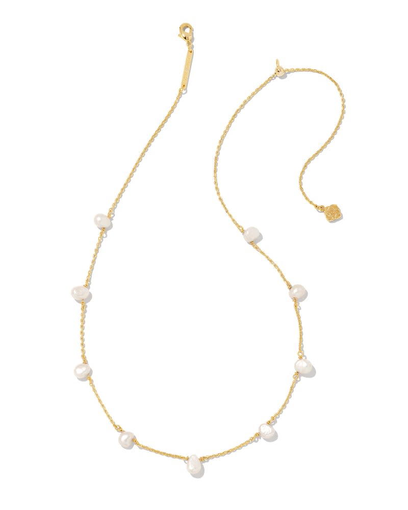 Leighton gold strand necklace featuring white pearls spaced along a delicate chain.