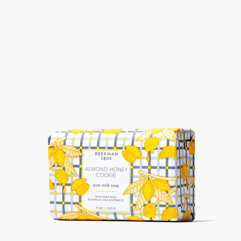 Triple-milled bar soap with a creamy off-white color featuring embedded speckles from goat milk and vegetable base ingredients.