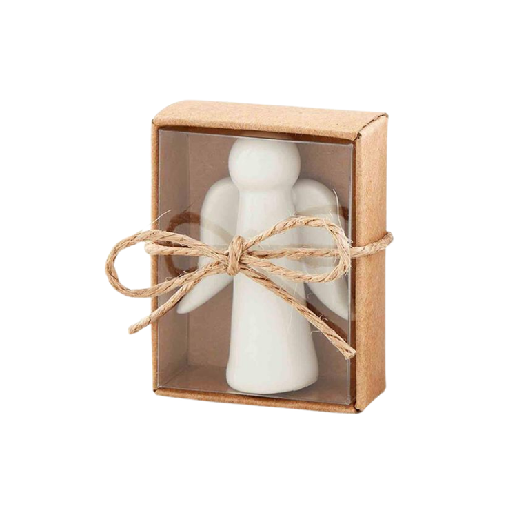 Small white ceramic angel figurine in a brown kraft gift box with a clear window and twine bow.